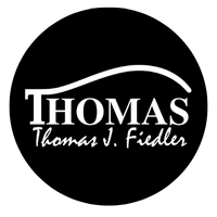 Thomas V Fiedler Logo redondo